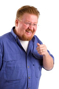 Red haired man with mustache and beard laughs and gestures with his hand.