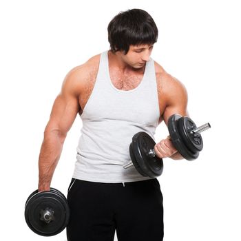 Muscular guy exercises with dumbbell on a white background