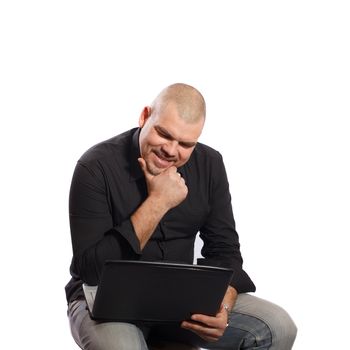 Thoughtful man sitting and looking at her computer on white background