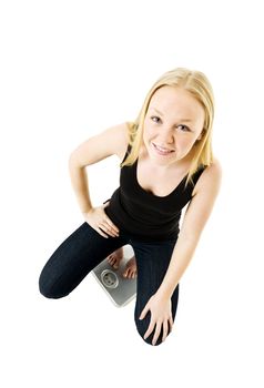 Young Girl on weight scale isolated on white background