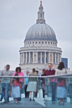 Cathedral Church of St Paul's in London, people walking over the millemium bridge