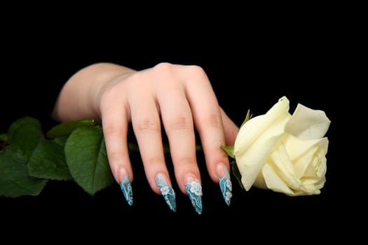 Human fingers with long fingernail and beautiful manicure isolated on black