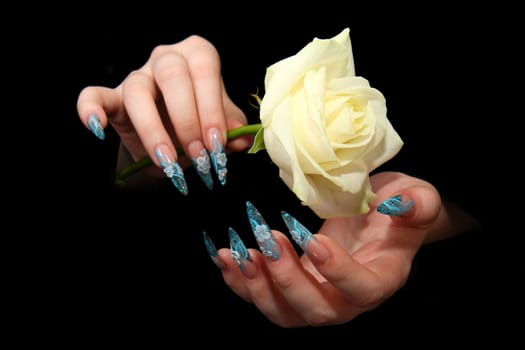 Human fingers with long fingernail and beautiful manicure isolated on black
