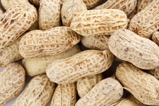 Background of roasted peanuts in shell