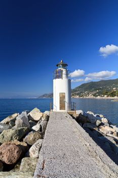 lighthouse over Mediterranean sea in Camogli, Italy