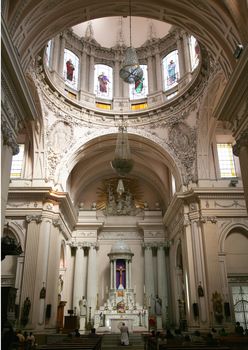 Priest saying mass Metropolitan Cathedral, Tempo de Santa Maria de Gracias, Guadalajara, Mexico.  This church was built in the 16th and 17th century in Guadalajara, Mexico