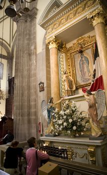 Praying to the Virgin Mary, Guadalupe, and confessing sins, Metropolitan Cathedral, Sagario Metropolitano, Mexico City, Mexico