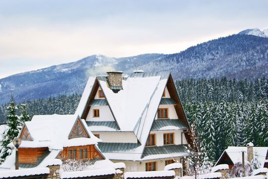 A house covered with snow in mountain village in Poland