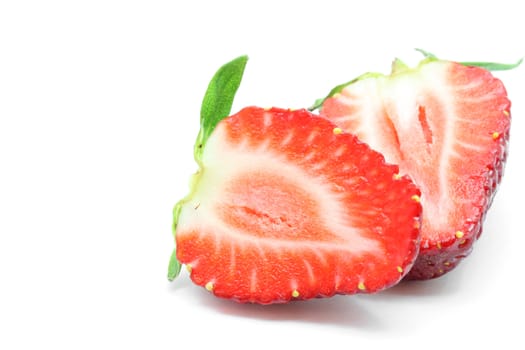 macro shot of cut half Strawberry isolated over white background