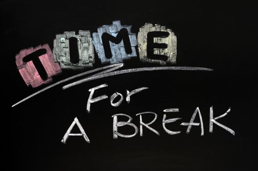 Time for a break written with chalk on blackboard