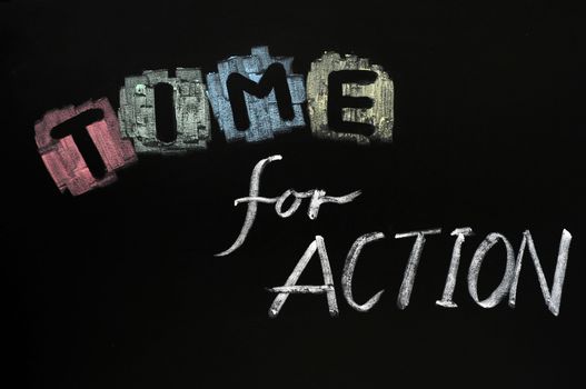 Time for action written with chalk on blackboard