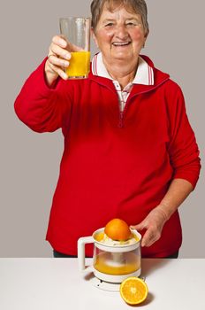 pensioner drinks orange juice