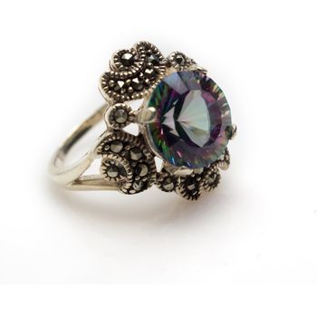 Sterling silver faceted mystic topaz round cut ring with marcasite. Isolated on white background with light shadow