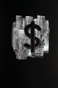 Symbol of US Dollar drawn with chalk on blackboard