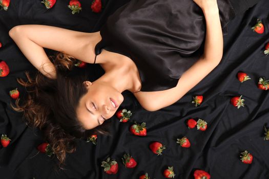 A young adult american woman dreaming of strawberries.