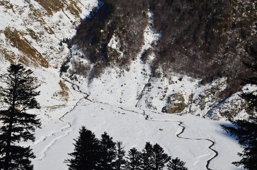 Winter lanscape of a valley vue from top in Pyrenees National Park seen from ski resort of Artouste in Atlantic Pyrenees.