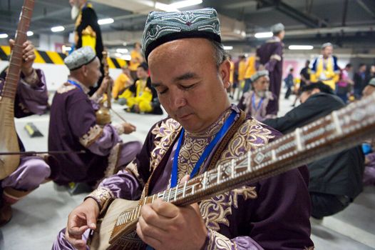 CHENGDU - MAY 29: Uighur Maixirefu folk musician performs in the 3rd International Festival of the Intangible Cultural Heritage.May 29, 20011 in Chengdu, China.