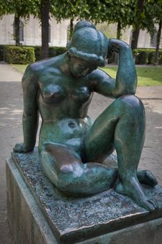 NUDE FEMALE SCULPTURE, PARIS, FRANCE - APRIL 24, 2011: The bronze sculpture Mediterranee by Aristide Maillol 1861 - 1944 placed in the park outside the Louvre, Paris.
