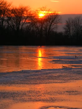 Sunset over frozen backwaters of the Kishwaukee River in northern Illinois.