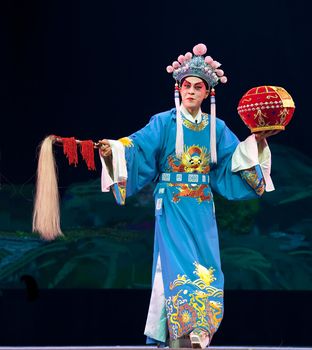 CHENGDU - JUN 5: chinese Sichuan opera performer make a show on stage to compete for awards in 25th Chinese Drama Plum Blossom Award competition at Chongzhou theater.Jun 5, 2011 in Chengdu, China.
Chinese Drama Plum Blossom Award is the highest theatrical award in China.
