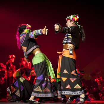 CHENGDU - OCT 27: chinese national dancers perform traditional dance Dynamic Yunnan on stage at Jincheng theater.Oct 27, 2011 in Chengdu, China.