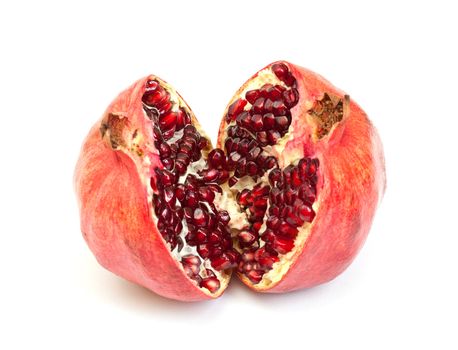 Broken pomegranate fruit on white background