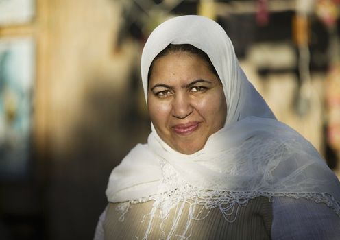 Muslim woman wearing a head scarf outdoors