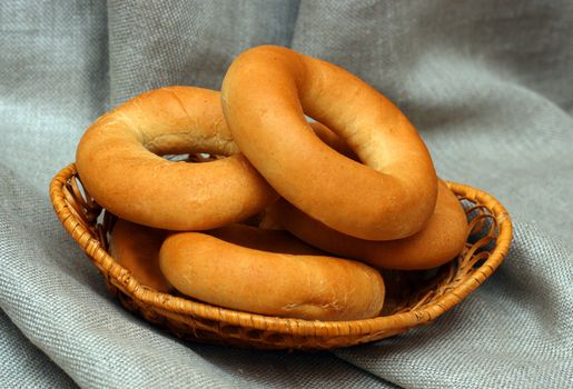 bagels in basket on canvas background