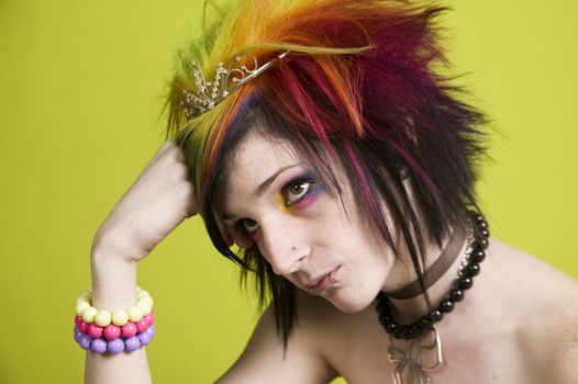 Close-up of a woman with bright mascara and colorful hair