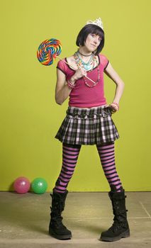 Pretty young woman holding a large lollipop