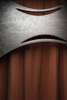 Metal on red velvet curtain