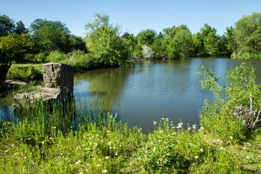 Fishing pond or just a nice view of a tranquil scene. Either idea works