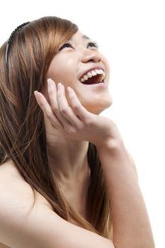 Laughing Asian woman looking up on white background