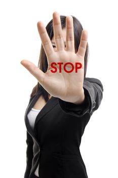 Serious business woman making stop sign over white background. Focus on hand