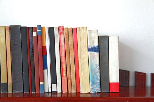 books on wooden bookshelf