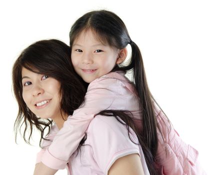 Asian mother piggyback her daughter, on white background