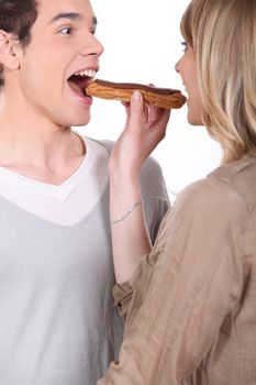 Couple eating a pastry