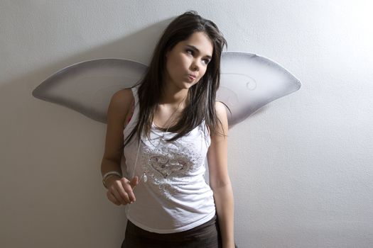 Young girl with butterfly wing being all cute