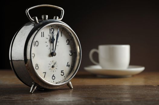 Alarm clock and coffee cup 