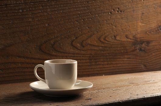 cup of coffee on the wooden table