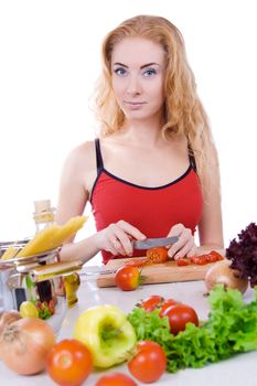 Woman with pasta ingredients cooking over white