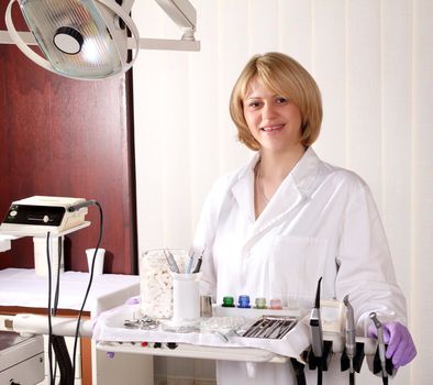 female dentist with medical equipment