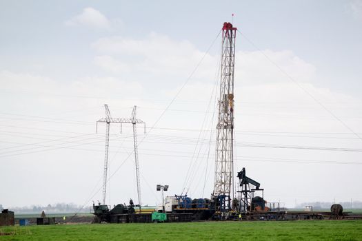 field with oil rig industry scene