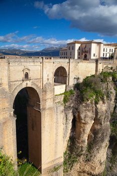 View of buildings in new town from other side of the 18th century bridge over the 300 ft Tajo Gorge in Ronda Spain