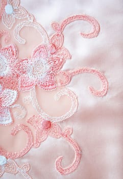 Flower lace on the elegant pink silk can use as wedding background