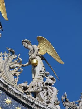 Venice - The basilica St Mark's. Angel from upper facade