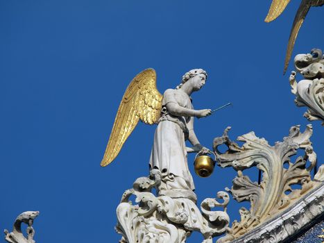 Venice - The basilica St Mark's. Angel from upper facade