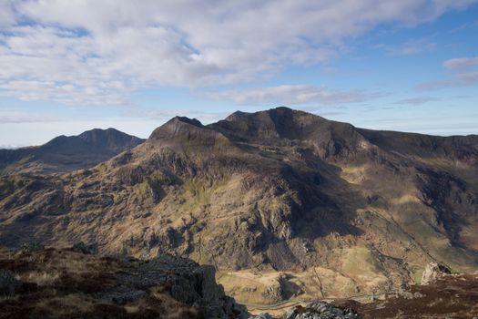 A view of the Snowdon mountain group, massif, with the peaks of Snowdon, Crib Goch, Crib y Ddysgl and Lliwedd, located in the Snowdonia National Park, Wales, UK.