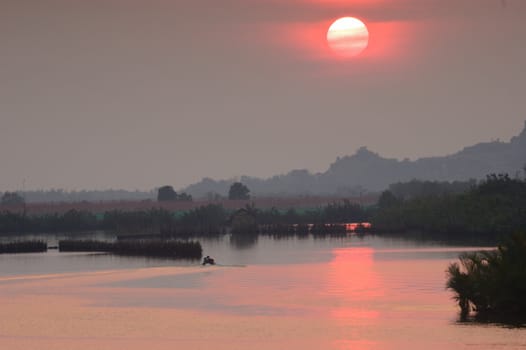 Sunset on the river, Thailand.