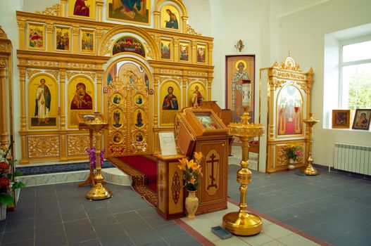 Beautiful church interior in golden light. 
Temple Theodore icon the Mother of God in Vorsino